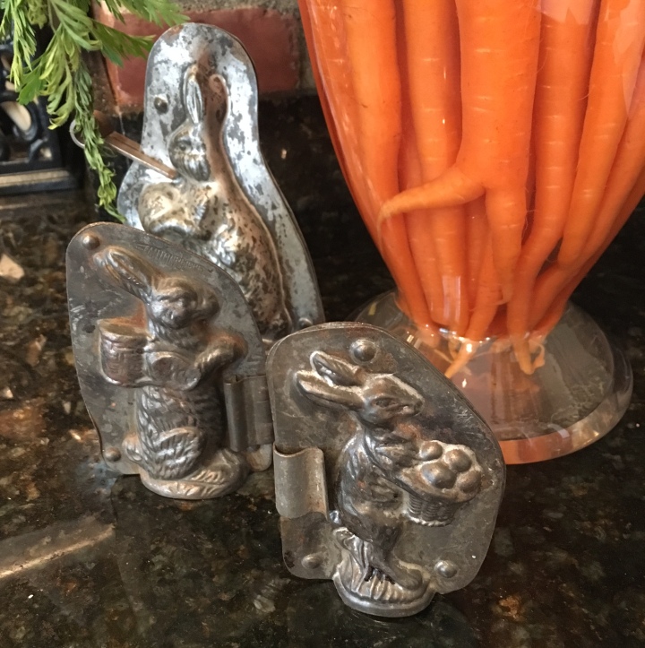 Carrots in apothocary jar w antique chocolate molds